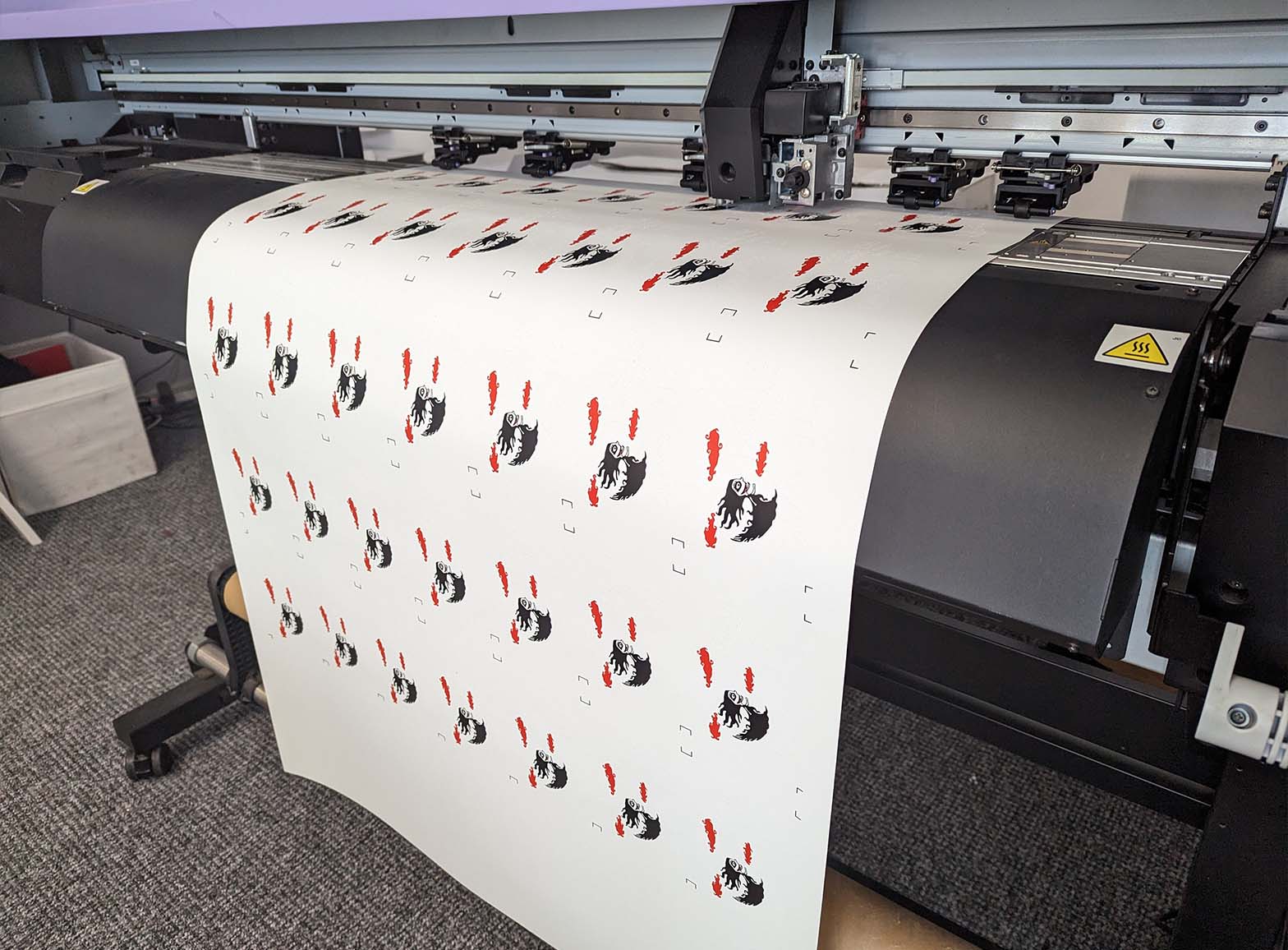 A photograph of the Full Colour Vinyl Print machines in the production process for a job for the Devon Lunatics.