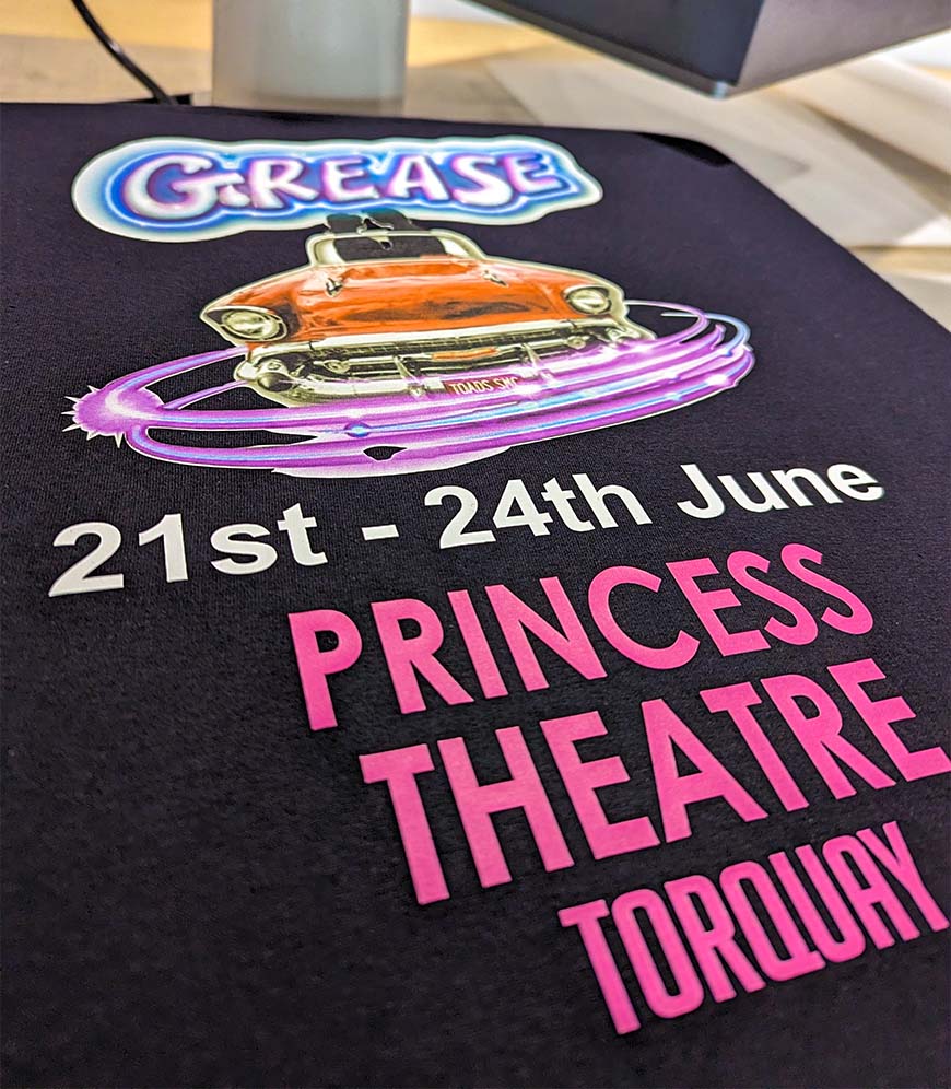A photo of the Full Colour Vinyl Print process for a job for Grease The Musical, completed by Clothing Your Way in Paignton, South Devon.