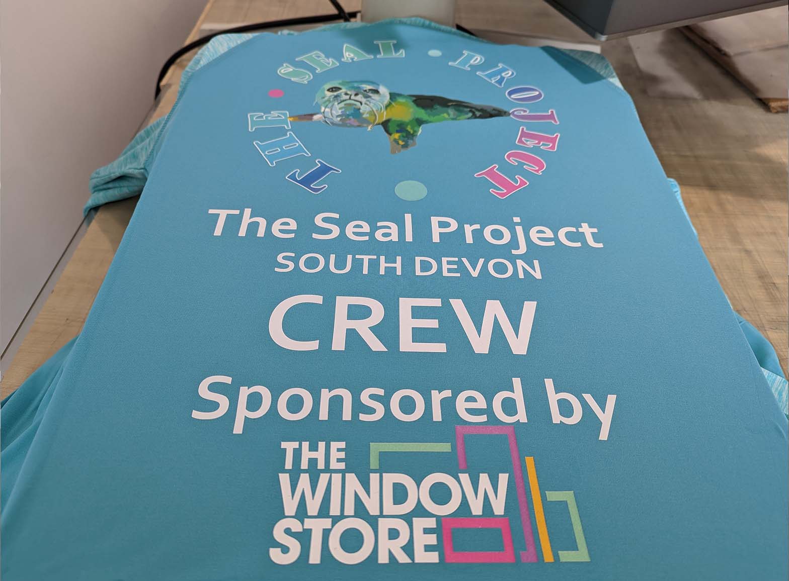 A photo of the Full Colour Vinyl Print process for a job for the Seal Project, completed by Clothing Your Way in Paignton, South Devon.